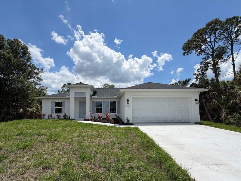 Front exterior of a new home in , North Port, FL, highlighting curb appeal (Image 1). Front exterior of a new home in , North Port, FL, highlighting curb appeal (Image 1).