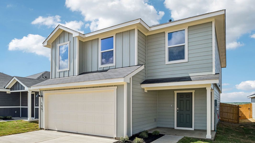 Front exterior of a new home in Prairie Lakes, Buda, TX, highlighting curb appeal (Image 2).
