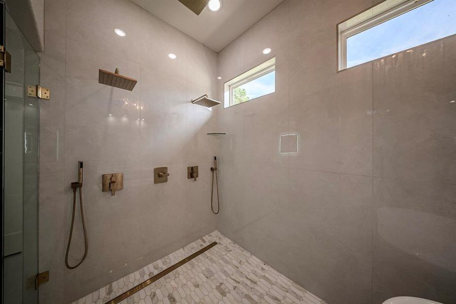 Full bathroom with tiled shower and recessed lighting Full bathroom with tiled shower and recessed lighting
