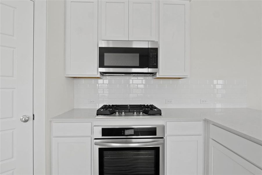 Kitchen in the Pecan II home plan by Trophy Signature Homes – REPRESENTATIVE PHOTO Kitchen in the Pecan II home plan by Trophy Signature Homes – REPRESENTATIVE PHOTO