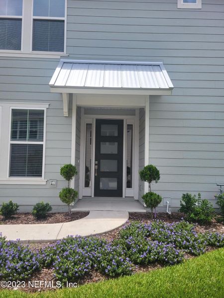 Front exterior of a new home in West End at Town Center, Nocatee, FL, highlighting curb appeal (Image 16). Front exterior of a new home in West End at Town Center, Nocatee, FL, highlighting curb appeal (Image 16).