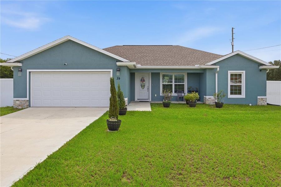 Front exterior of a new home in , Ocala, FL, highlighting curb appeal (Image 1). Front exterior of a new home in , Ocala, FL, highlighting curb appeal (Image 1).