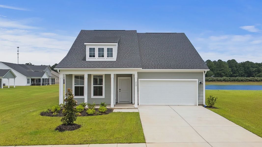 Front exterior of a new home in Bluffs at Sun Colony, Longs, SC, highlighting curb appeal (Image 1). Front exterior of a new home in Bluffs at Sun Colony, Longs, SC, highlighting curb appeal (Image 1).