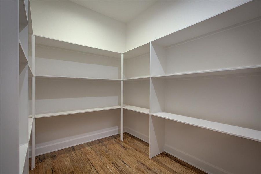 HUGE pantry with lots of shelving.