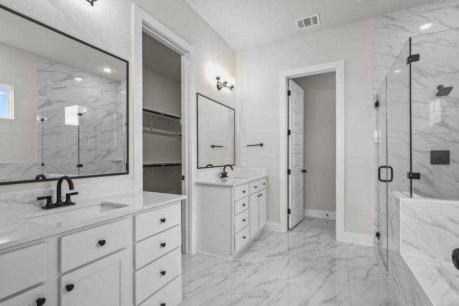 A bathroom with a tub sink and mirror. A bathroom with a tub sink and mirror.