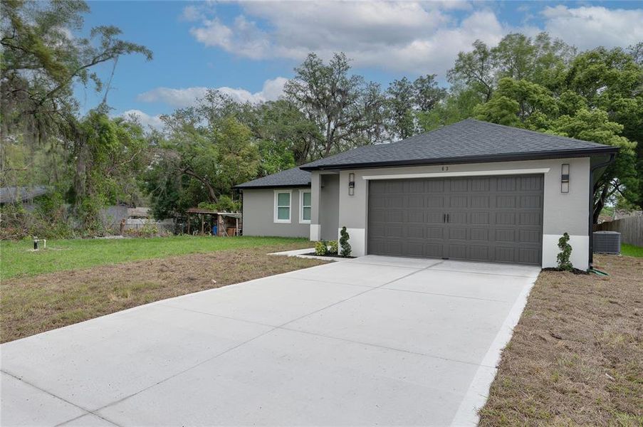 Front exterior of a new home in , Debary, FL, highlighting curb appeal (Image 23). Front exterior of a new home in , Debary, FL, highlighting curb appeal (Image 23).