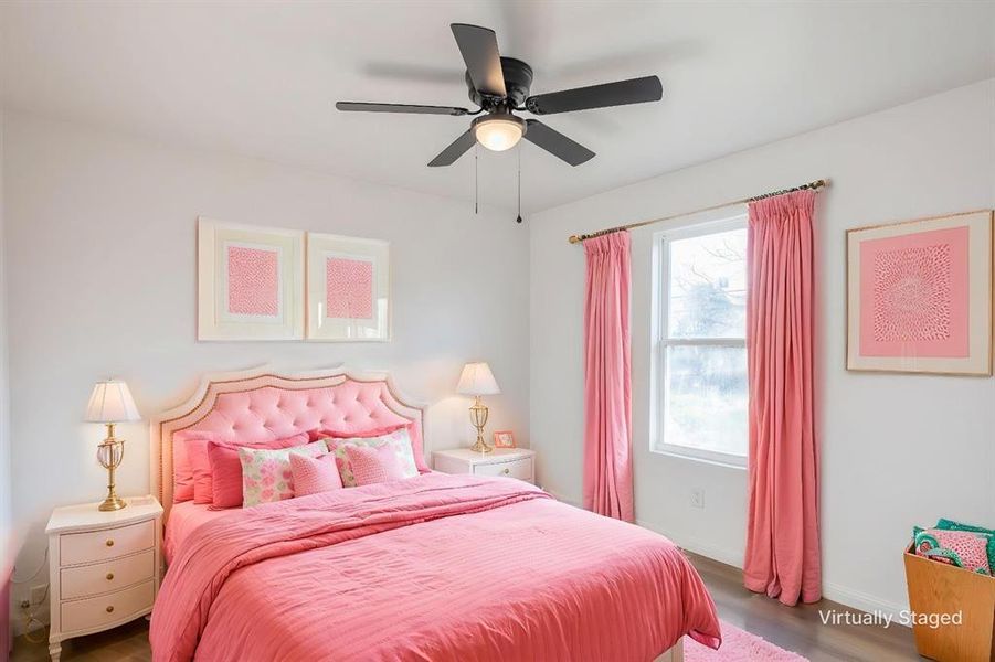 Bedroom featuring wood finished floors and ceiling fan