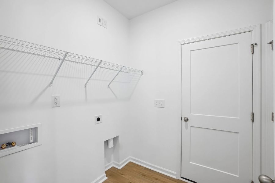 Laundry Room featuring the AW Collection® Serene - Light finishes and simple wire shelving.