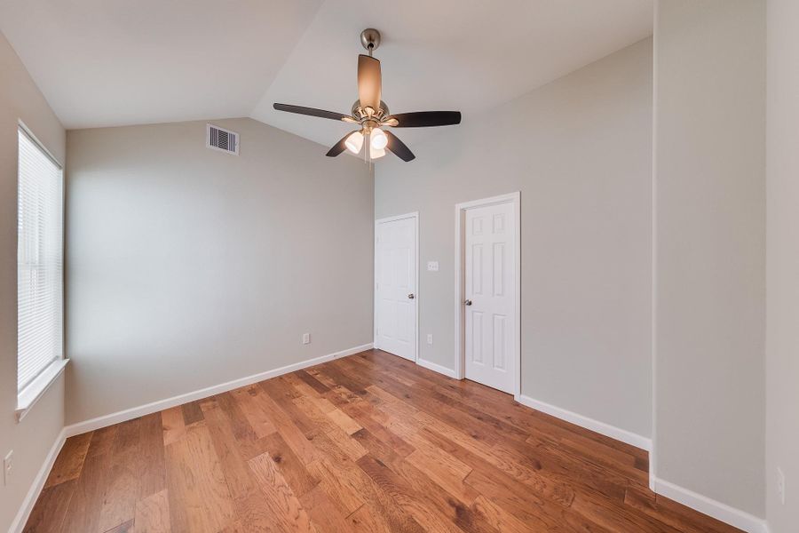 These adaptable secondary bedrooms offer the perfect layout for a chic home office, guest retreat, or creative hobby studio.