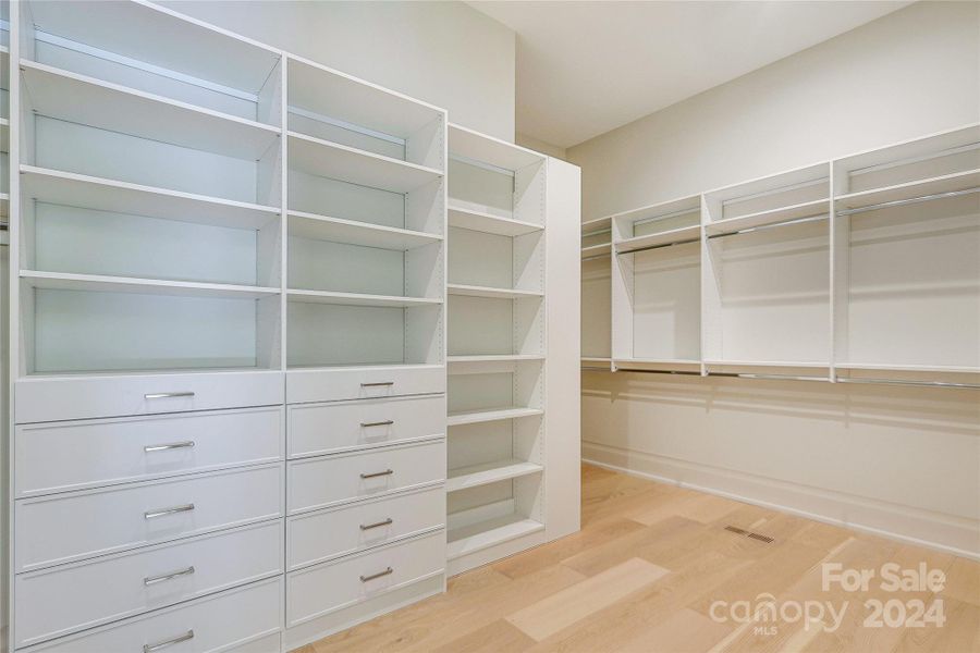 Primary walk-in closet with upgraded closet system