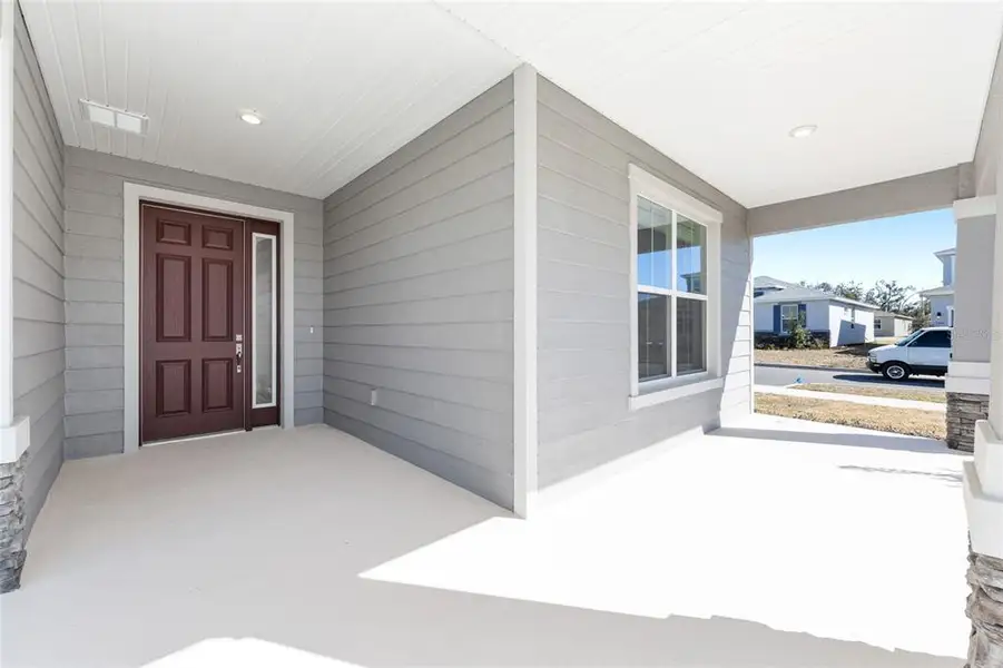 Exterior details and patio area of a home in Calesa Township, Ocala (Image 3).