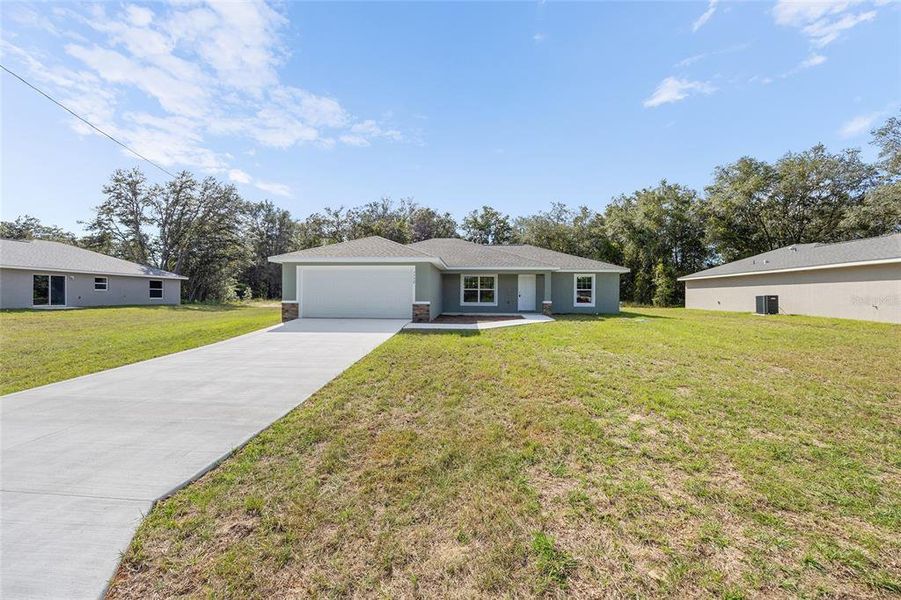 Front exterior of a new home in , Ocala, FL, highlighting curb appeal (Image 1). Front exterior of a new home in , Ocala, FL, highlighting curb appeal (Image 1).
