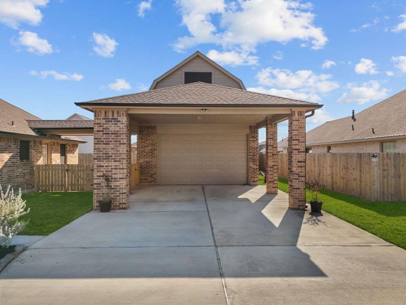 Front exterior of a new home in Pedregal, Dickinson, TX, highlighting curb appeal (Image 21). Front exterior of a new home in Pedregal, Dickinson, TX, highlighting curb appeal (Image 21).