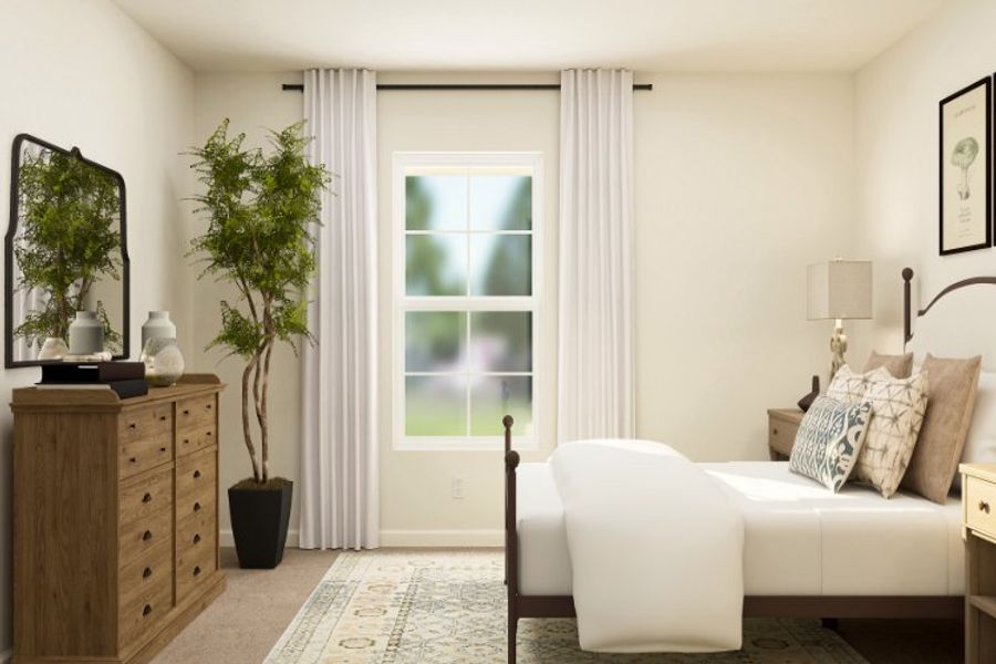 A room with a couch and a table with a plant in it. A room with a couch and a table with a plant in it.