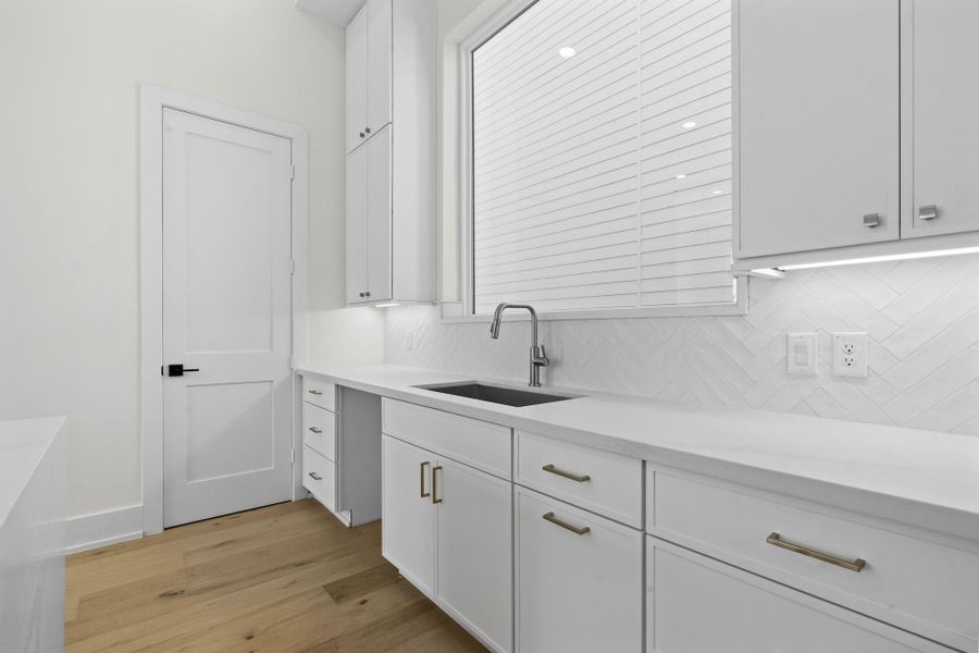 Walk in pantry - Your view from the dining room to the living room with access to your balcony. -  Come tour our furnished model home open Saturday & SundayEstimated completion November 30, 2025.