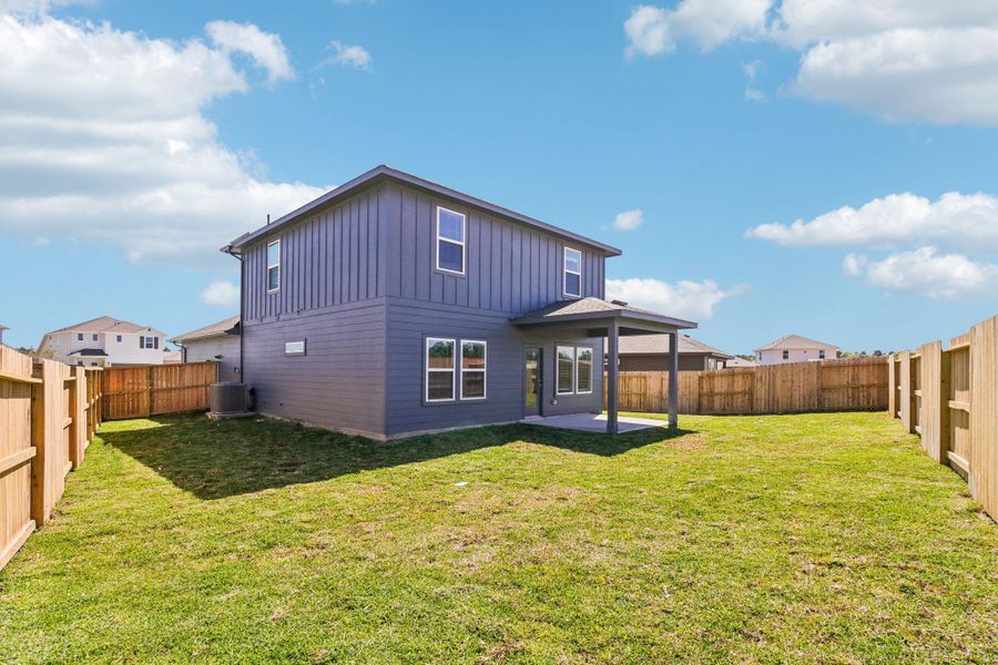Exterior details and patio area of a home in Granger Pointe - Traditional Series, Conroe (Image 22).