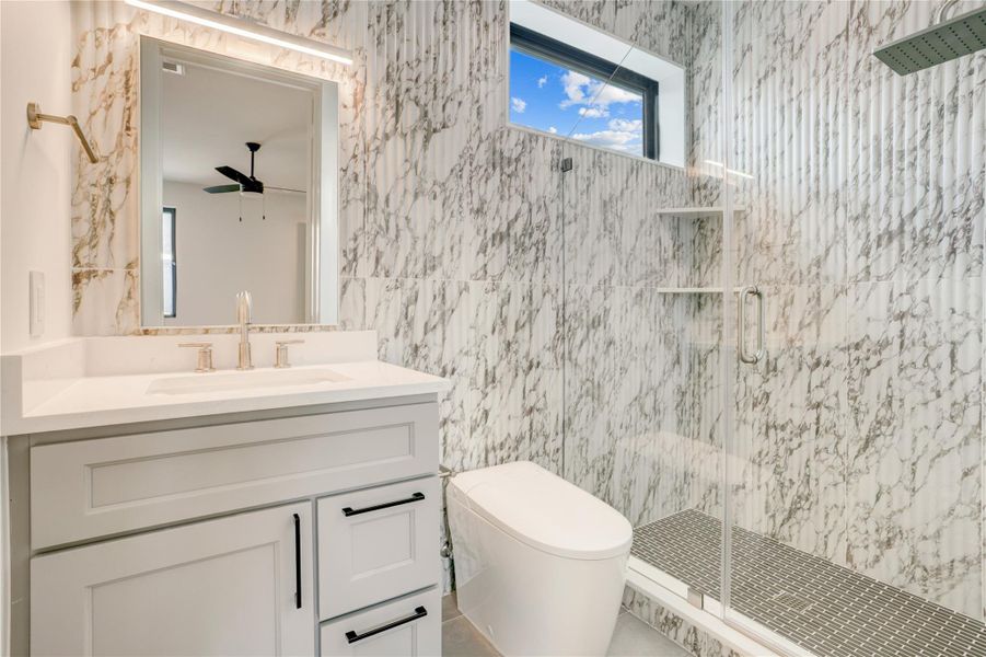 Third-floor ensuite bath with walk-in shower.