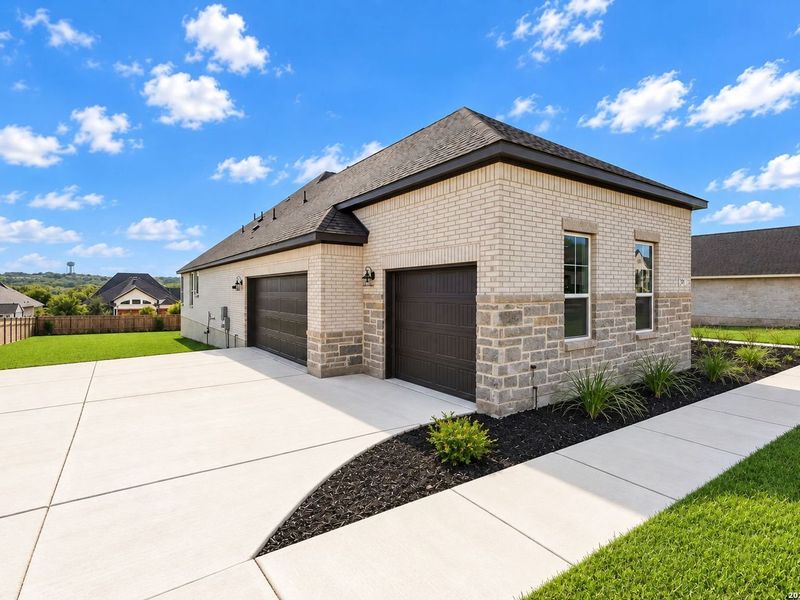 Front exterior of a new home in Potranco Oaks, Castroville, TX, highlighting curb appeal (Image 27).