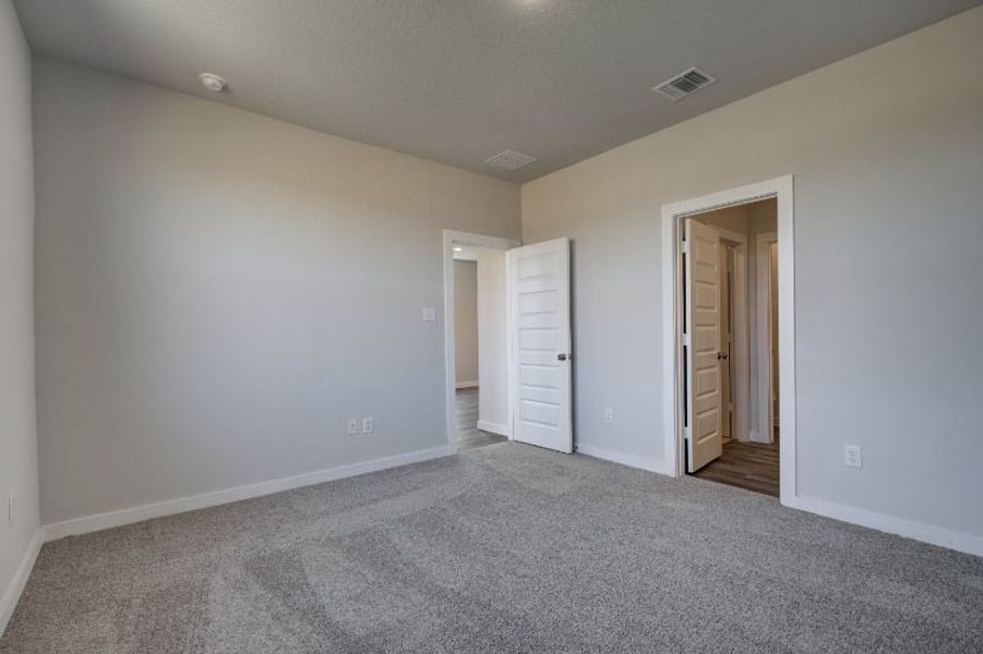 A hallway with white walls. A hallway with white walls.