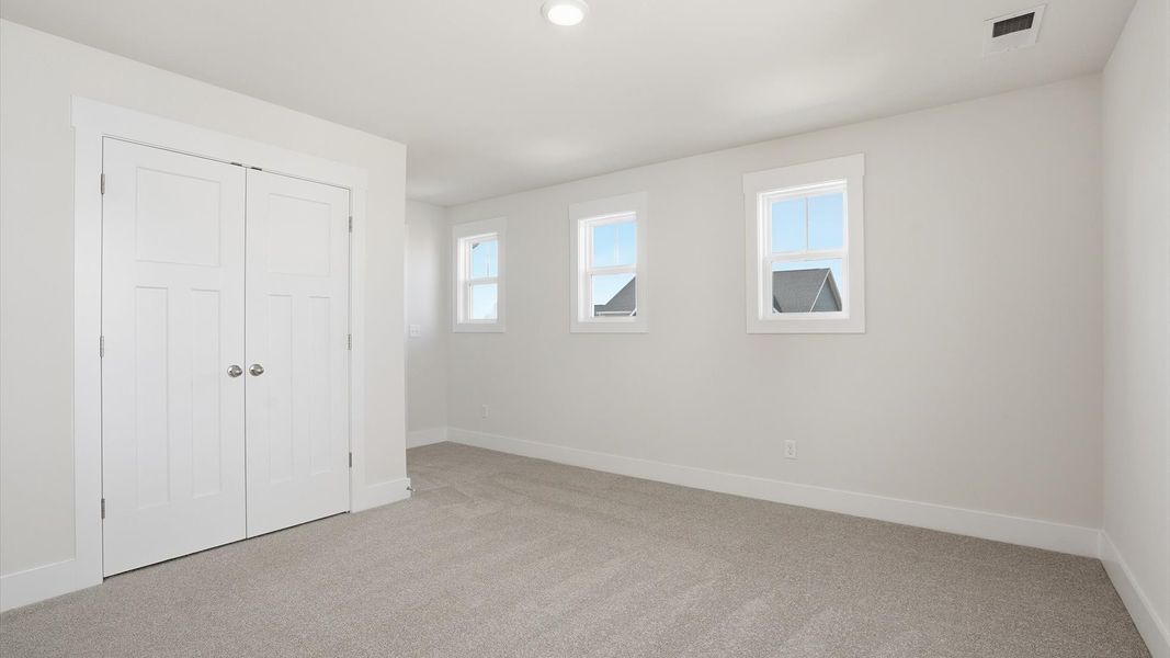 Well-crafted bedroom offering premium comfort and expansive storage solutions by DRB Homes Well-crafted bedroom offering premium comfort and expansive storage solutions by DRB Homes