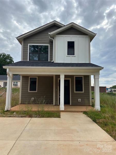 Front exterior of a new home in , Hickory, NC, highlighting curb appeal (Image 1).