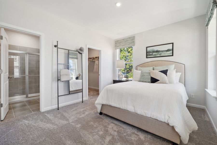 A bedroom with a large bed.