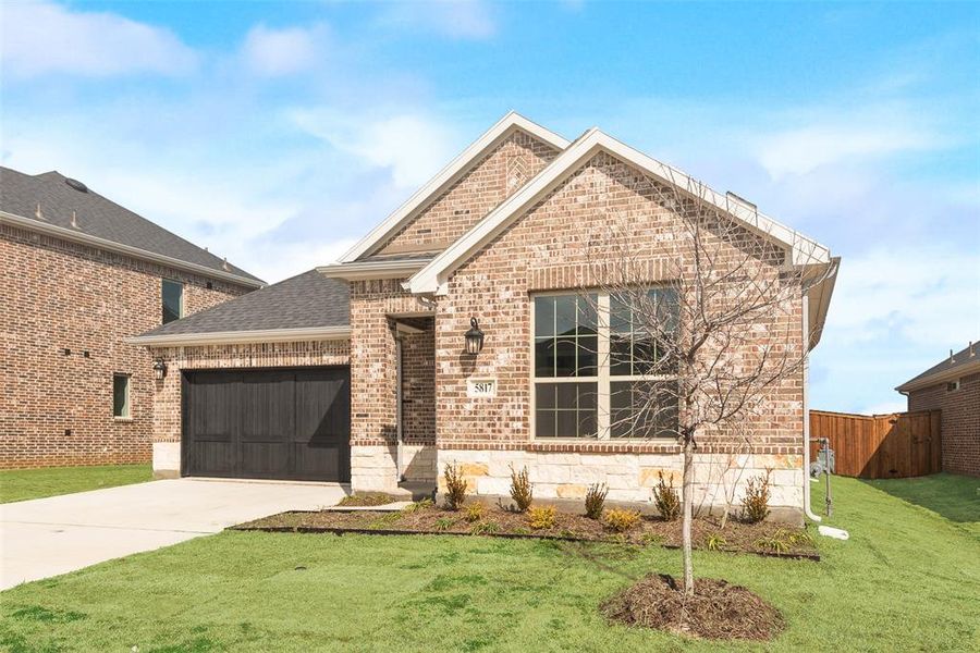 Front exterior of a new home in Sutton Fields, Celina, TX, highlighting curb appeal (Image 20).