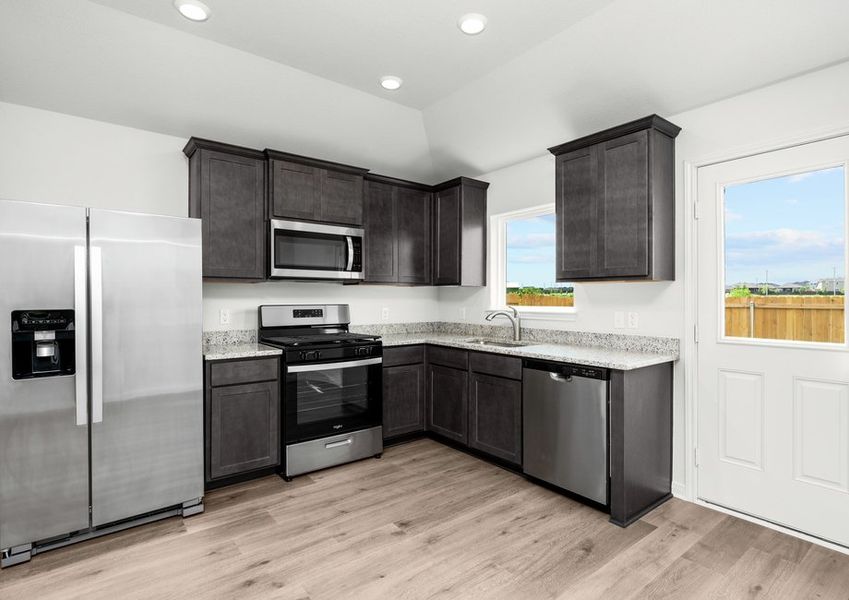 The kitchen has energy-efficient, stainless steel appliances.
