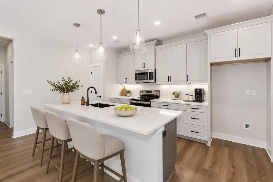 Representative furnished interior of a home built from the Ashford by Perfection Builders in The Courtyards at Cornerstone, Andover (Image 3).
