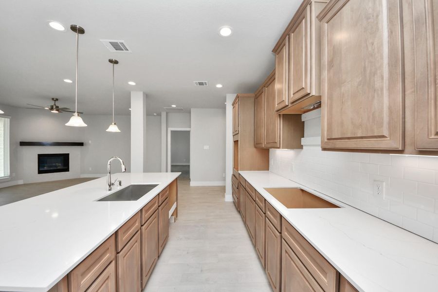 This generously spacious kitchen is a dream realized! Sample photo of completed home with similar floor plan. Actual colors and selections may vary. This generously spacious kitchen is a dream realized! Sample photo of completed home with similar floor plan. Actual colors and selections may vary.