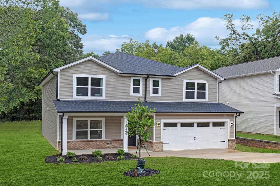 Front exterior of a new home in , Huntersville, NC, highlighting curb appeal (Image 22). Front exterior of a new home in , Huntersville, NC, highlighting curb appeal (Image 22).