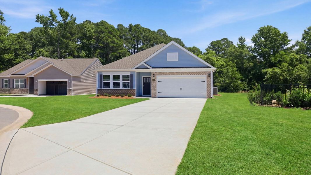 Front exterior of a new home in Villa Grande, Winterville, NC, highlighting curb appeal (Image 17). Front exterior of a new home in Villa Grande, Winterville, NC, highlighting curb appeal (Image 17).