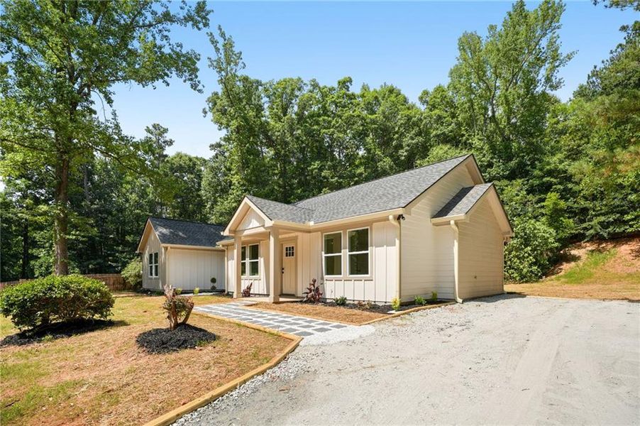 Front exterior of a new home in , Loganville, GA, highlighting curb appeal (Image 2). Front exterior of a new home in , Loganville, GA, highlighting curb appeal (Image 2).