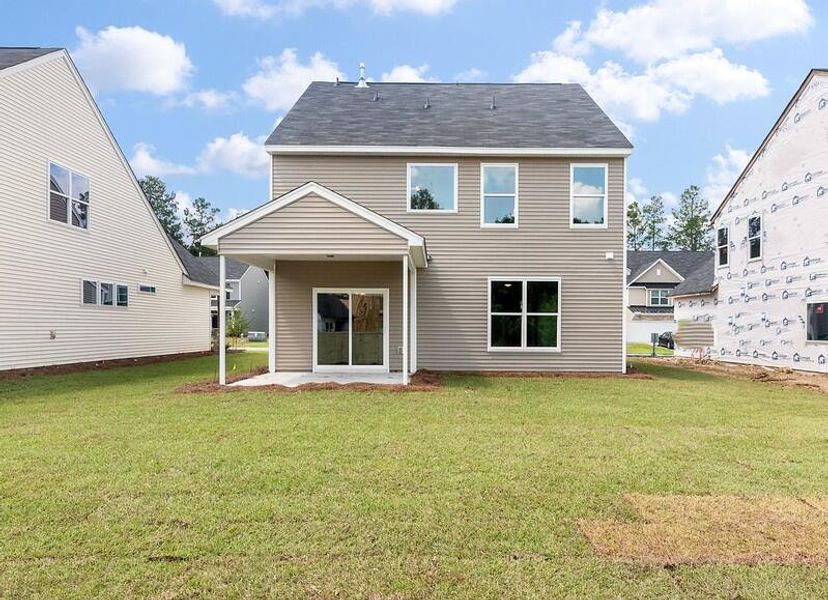 Front exterior of a new home in Parker's Preserve, Ridgeville, SC, highlighting curb appeal (Image 2).