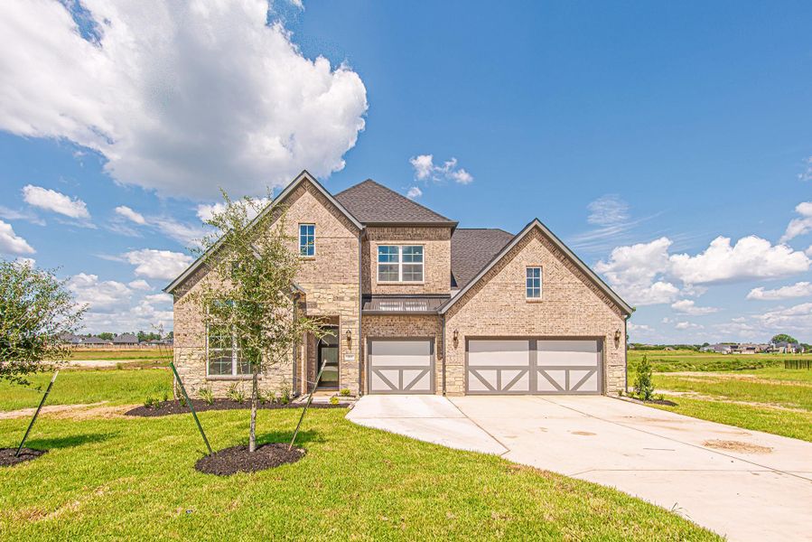 Front exterior of a new home in WaterStone, Montgomery, TX, highlighting curb appeal (Image 2). Front exterior of a new home in WaterStone, Montgomery, TX, highlighting curb appeal (Image 2).