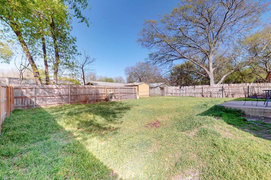 View of yard with a patio and a fenced backyard
