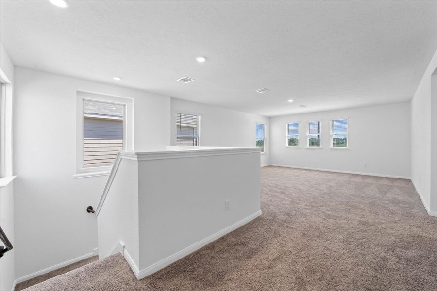 Head upstairs and enjoy the Loft—an additional living area perfect for a game room, media space, or a peaceful retreat.