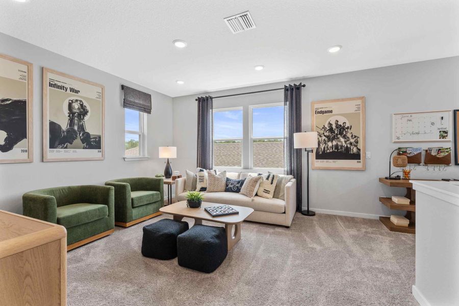 Silverbell II Model Home Loft with Couch and Chairs at Camden Woods in Kingsland, GA