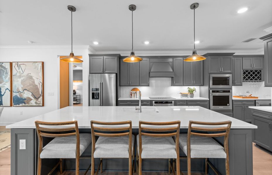 Designer kitchen featuring stainless steel appliances Designer kitchen featuring stainless steel appliances