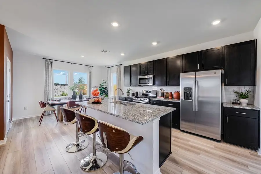 Representative furnished interior of a home built from the Kestrel by Taylor Morrison in Longview 40s, Del Valle (Image 4).
