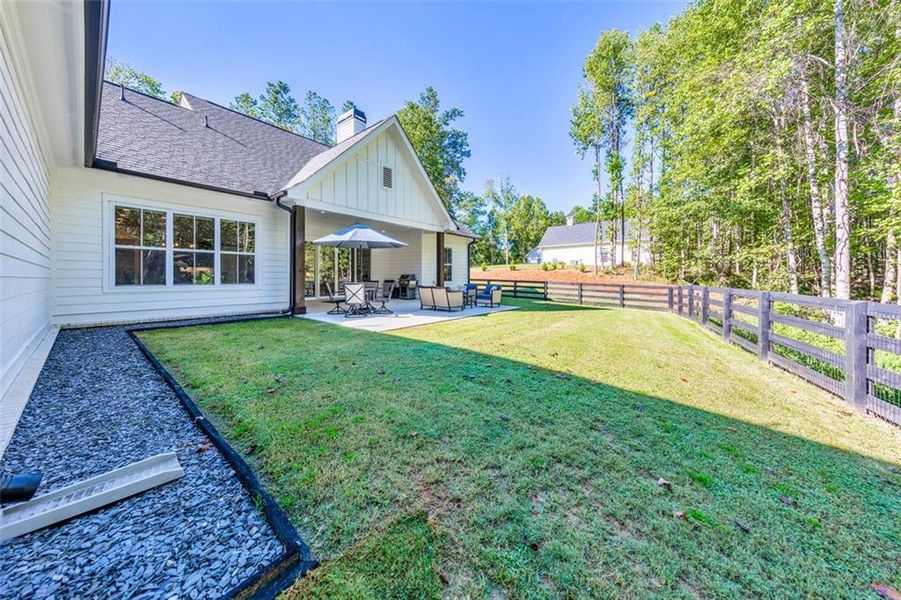 Front exterior of a new home in , Woodstock, GA, highlighting curb appeal (Image 23).
