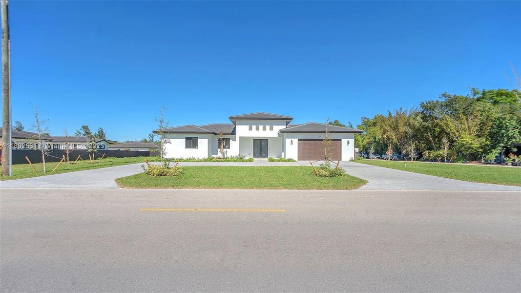 Front exterior of a new home in , Miami, FL, highlighting curb appeal (Image 26).