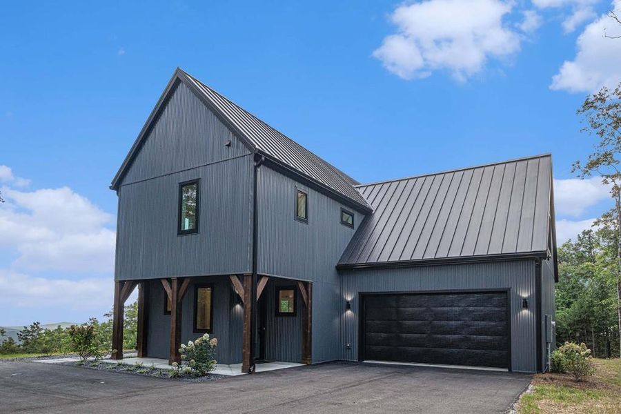 Front exterior of a new home in , Clayton, GA, highlighting curb appeal (Image 24).