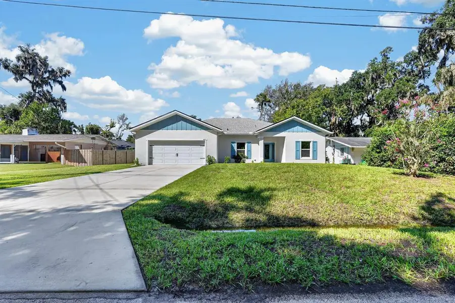 Front exterior of a new home in , New Smyrna Beach, FL, highlighting curb appeal (Image 20).