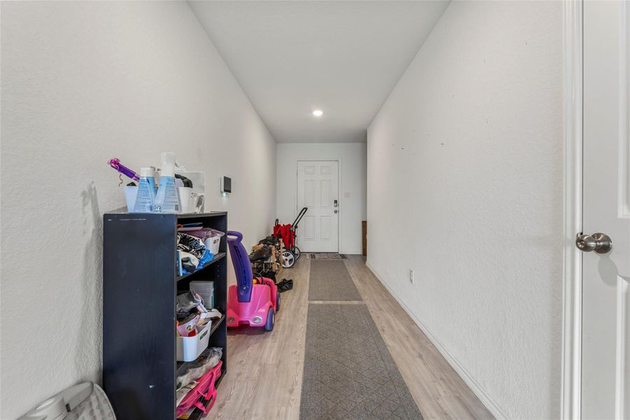 A welcoming entryway with durable flooring and direct access to various areas of the home.