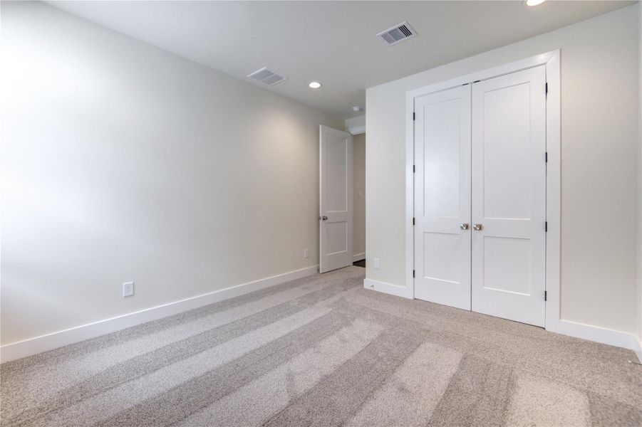 The second of the three secondary bedrooms