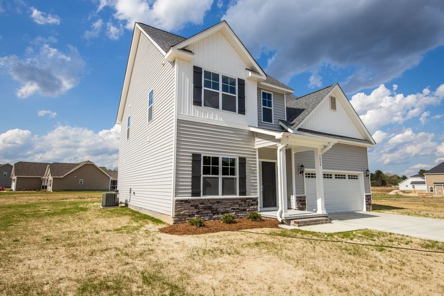 Representative exterior photo of a completed home built from the Ryder by Bill Clark Homes in Arbor Hills South II, Greenville, NC (Image 22). Representative exterior photo of a completed home built from the Ryder by Bill Clark Homes in Arbor Hills South II, Greenville, NC (Image 22).