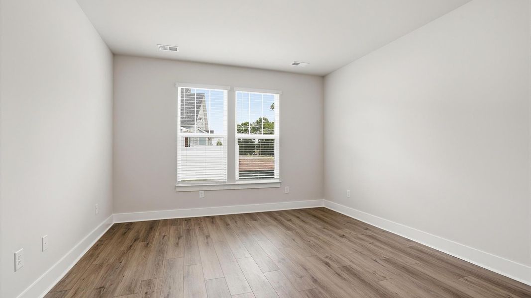 Primary suite that offers first-rate relaxation with established style and elevated finishes by DRB Homes Primary suite that offers first-rate relaxation with established style and elevated finishes by DRB Homes