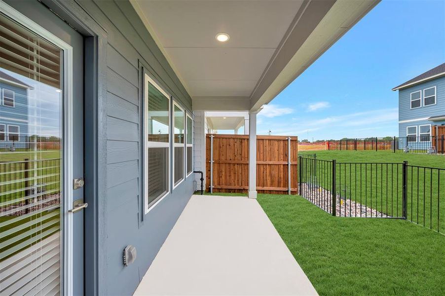 Exterior details and patio area of a home in Providence Commons, Providence Village (Image 2). Exterior details and patio area of a home in Providence Commons, Providence Village (Image 2).