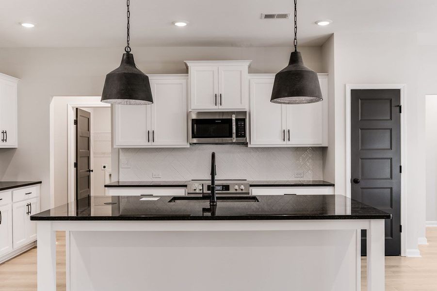 Furnished interior view inside a new home in LOVVORN ESTATES, Carrollton (Image 7).